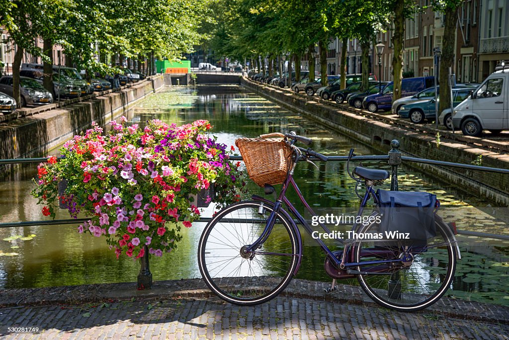 Bicycle and flowers on a bridge