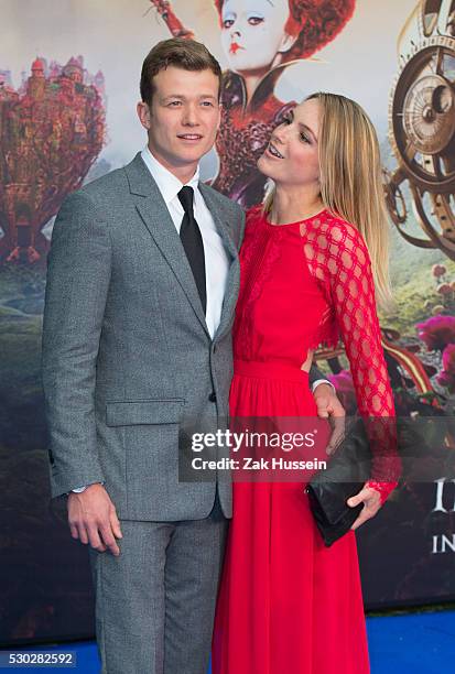 Ed Speleers and wife Asia Macey attend the European Film Premiere of "Alice Through The Looking Glass" at Odeon Leicester Square on May 10, 2016 in...