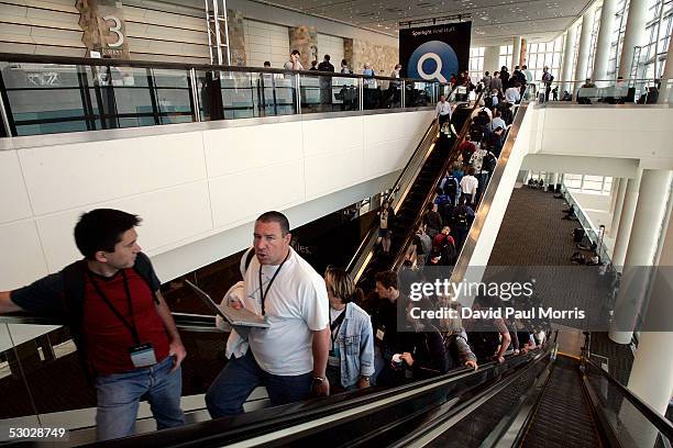 Programmers in the foyer wait for the next program at the Apple Worldwide Developers Conference at the Moscone Center on June 6, 2005 in San...