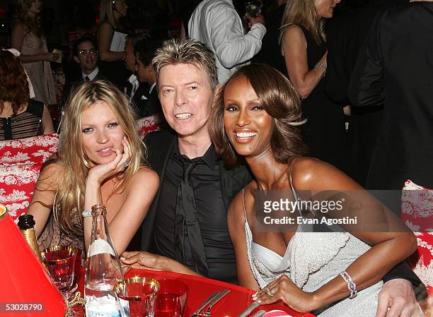 Kate Moss, David Bowie and his wife Iman pose for a photo at the 2005 CFDA Awards dinner party at the New York Public Library June 6, 2005 in New...