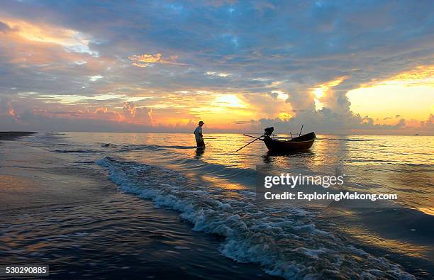 fisherman and his boat - fishing village stock pictures, royalty-free photos & images