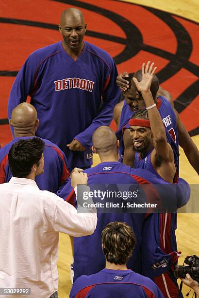 Richard Hamilton of the Detroit Pistons celebrates with teammates following the Pistons 88-82 win against the Miami Heat in Game Seven of the Eastern...