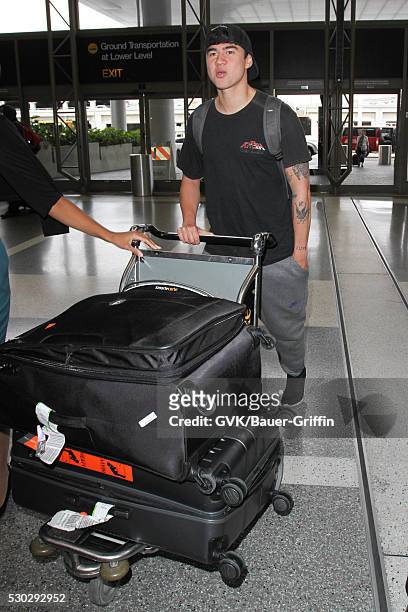 Calum Hood is seen at LAX on May 10, 2016 in Los Angeles, California.