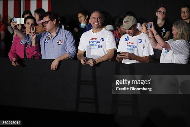 Attendees wait for the start of a campaign event for Hillary Clinton, former Secretary of State and 2016 Democratic presidential candidate, not...