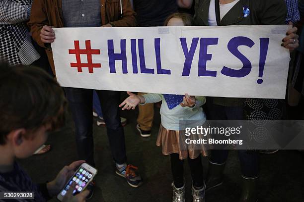 Attendees stand for a photo before a campaign event for Hillary Clinton, former Secretary of State and 2016 Democratic presidential candidate, not...