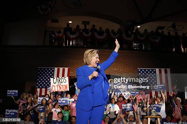 Hillary Clinton, former Secretary of State and 2016 Democratic presidential candidate, waves to attendees during a campaign event in Louisville,...