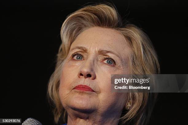 Hillary Clinton, former Secretary of State and 2016 Democratic presidential candidate, pauses while speaking during a campaign event in Louisville,...