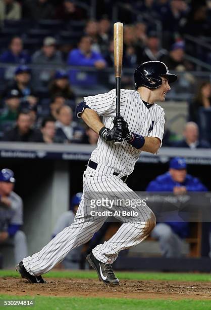 Dustin Ackley of the New York Yankees drives in a run in the seventh inning against the Kansas City Royals during their game at Yankee Stadium on May...