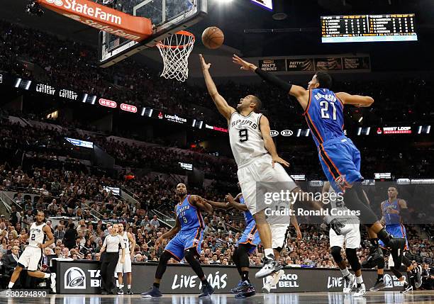 Kawhi Leonard of the San Antonio Spurs scores in front of Andre Roberson of the Oklahoma City Thunderin game Five of the Western Conference...