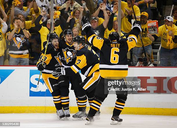 Carl Hagelin of the Pittsburgh Penguins celebrates his second period goal against the Washington Capitals in Game Six of the Eastern Conference...