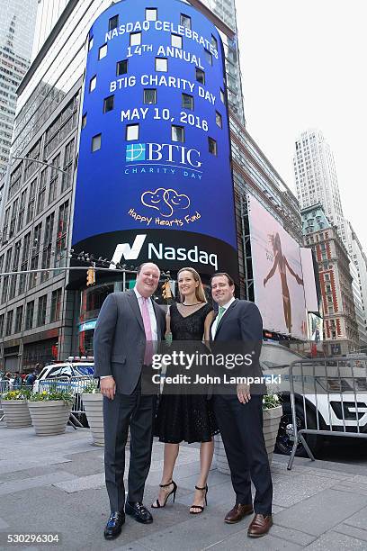 Of NASDAQ, David Wicks, Petra Nemcova and BTIG Managing Director Peter Terran ring Nasdaq Closing Bell for Charity Day at NASDAQ on May 10, 2016 in...