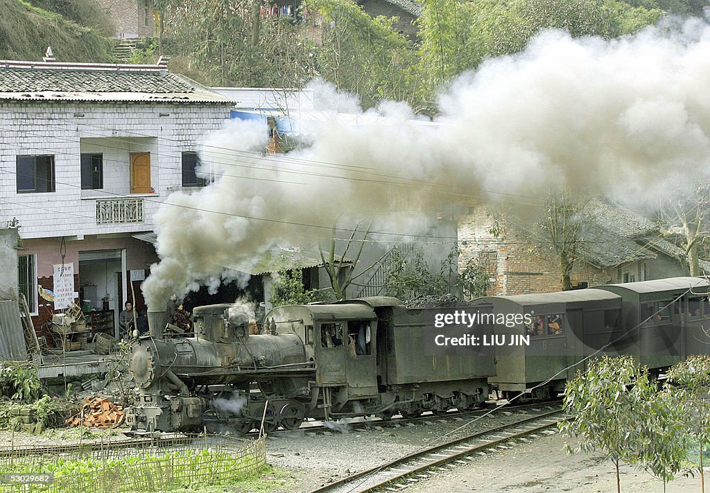 A steam locomotive train drives through