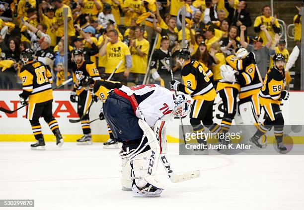 Braden Holtby of the Washington Capitals reacts after losing to the Pittsburgh Penguins in overtime 4-3 in Game Six of the Eastern Conference Second...