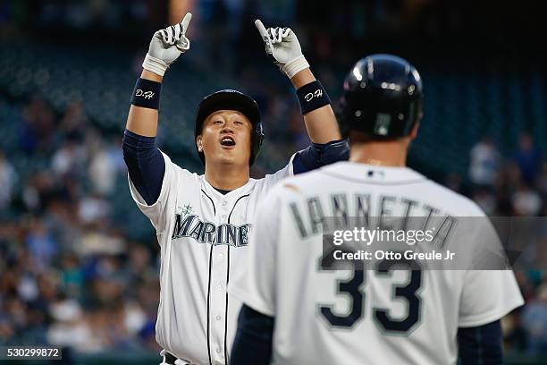 Dae-Ho Lee of the Seattle Mariners celebrates as he crosses home plate after hitting a three-run home run against the Tampa Bay Rays in the fourth...