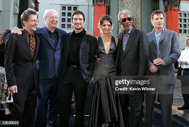 Actors Gary Oldman, Sir Michael Caine, Christian Bale, Katie Holmes, Morgan Freeman and Liam Neeson pose as they arrive at the premiere of "Batman...