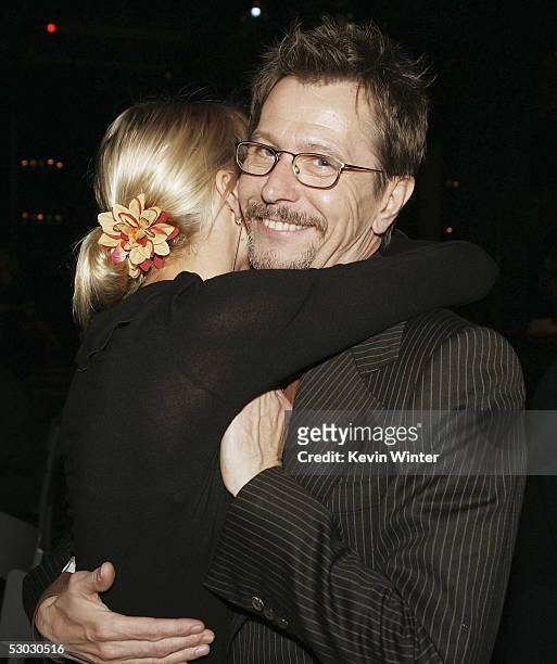 Actor Gary Oldman and Alisa Marshall pose at the afterparty for the premiere of Warner Bros. Pictures' "Batman Begins" at the Kodak Theatre Ballroom...