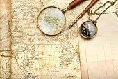 An  brass compass on a old map background