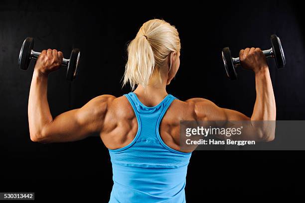 muscular woman lifting weights - beautiful armenian women stock pictures, royalty-free photos & images