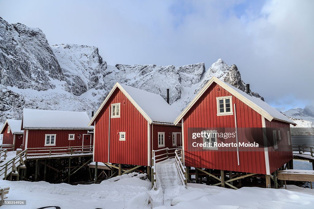 Fresh snow covering the typical Norwegian homes, the Rorbu, in the Lofoten Islands, Arctic, Norway, Scandinavia, Europe