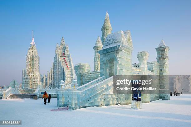 spectacular ice sculptures at the harbin ice and snow festival in harbin, heilongjiang province, china, asia - ice sculpture stock-fotos und bilder