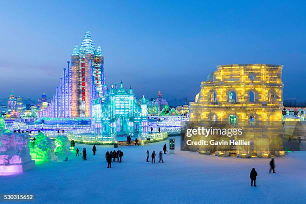 spectacular illuminated ice sculptures at the harbin ice and snow festival in harbin, heilongjiang province, china, asia - harbin stock pictures, royalty-free photos & images