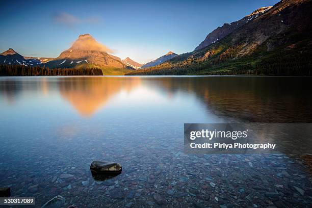 sunrise at two medicine - two medicine lake montana stock pictures, royalty-free photos & images