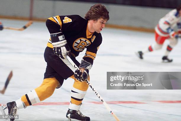 Boston Bruins' defenceman Bobby Orr carries the puck against the Washington Capitals during a game at Capital Centre circa the 1970's in Washington,...