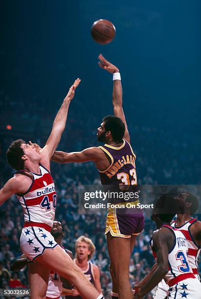 Los Angeles Lakers' center Kareem Abdul Jabbar jumps and shoots against the Washington Bullets during a game at Capital Center circa the 1970's in...