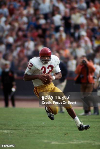 University of Southern California Trojans' running back O.J. Simpson runs with the ball during a game.