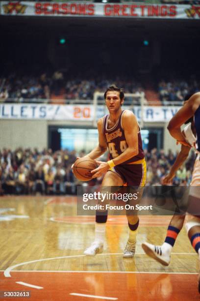 Los Angeles Lakers' guard Jerry West dribbles during a game. NOTE TO USER: User expressly acknowledges and agrees that, by downloading and or using...