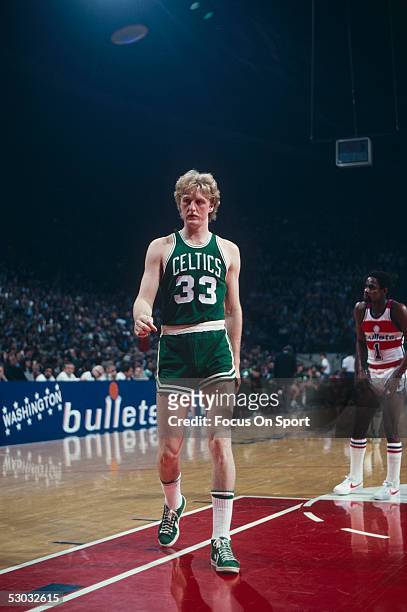Boston Celtics' forward Larry Bird walks to the side line during a game against the Washington Bullets at Capital Centre circa 1980 in Washington,...