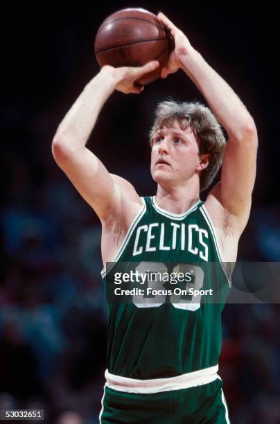 Boston Celtics' center Larry Bird shoots from the foul line during a game. NOTE TO USER: User expressly acknowledges and agrees that, by downloading...