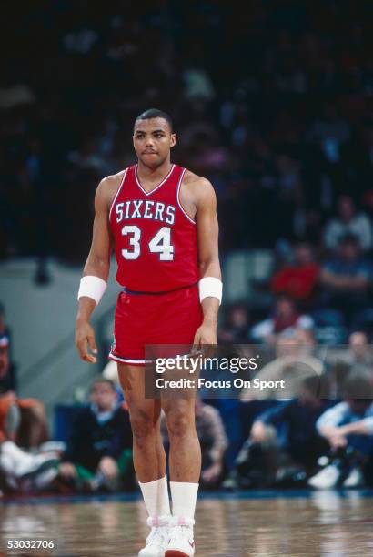 Philadelphia 76ers' forward Charles Barkley walks on the court during a game against the Washington Bullets at Capital Centre circa 1985 in...