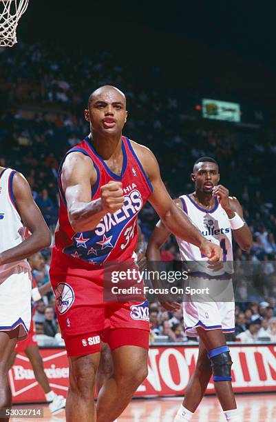 Philadelphia 76ers' forward Charles Barkley gestures with his fist after scoring against the Washington Bullets at Capital Centre circa 1991 in...