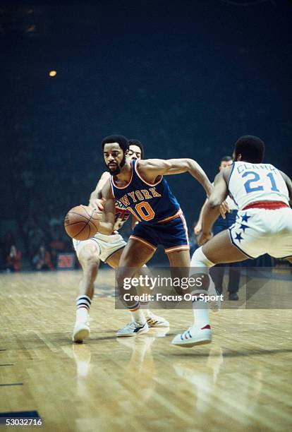 New York Knicks' guard Walt Frazier dribbles the ball against the Washington Bullets at Capital Center circa early 1970's in Washington, DC. NOTE TO...