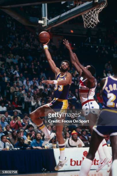Los Angeles Lakers' center Kareem Abdul Jabbar jumps and makes a hook shot against the Washington Bullets during a game at Capital Center circa 1978...