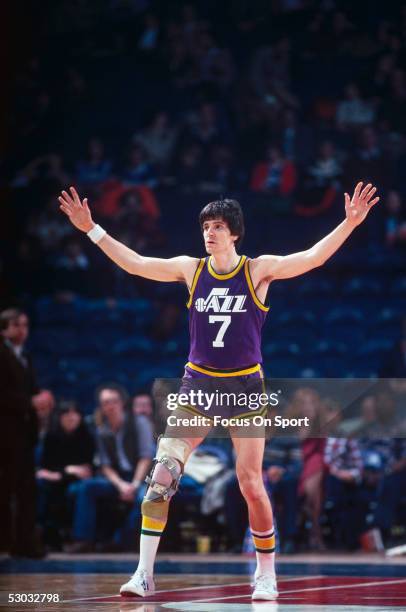 Utah Jazz's guard Pete Maravich waves his arms as he looks to recieve a pass during a game. NOTE TO USER: User expressly acknowledges and agrees...