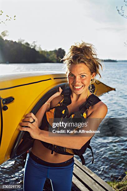 a young woman with a kayak sweden - carrying kayak stock pictures, royalty-free photos & images