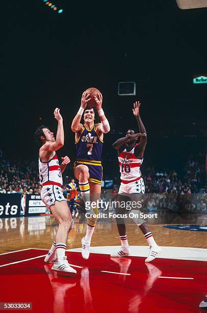 Utah Jazz's guard Pete Maravich jumps and shoots near the basket during a game against the Washington Bullets at Capital Center circa 1977 in...