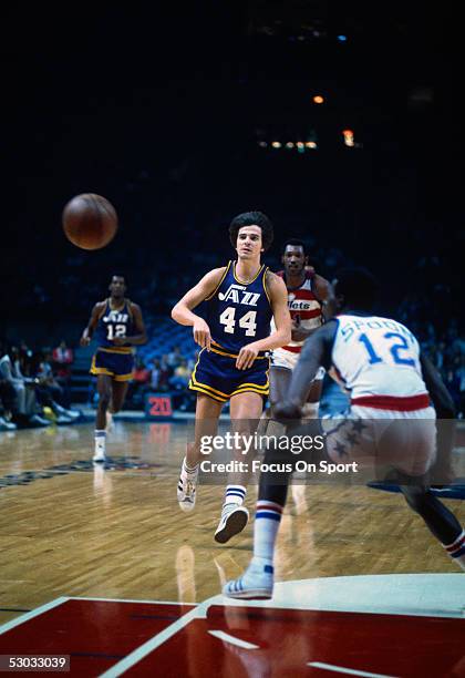 New Orleans Jazz's guard Pete Maravich passes near the basket during a game against the Washington Bullets at Capital Center circa the 1970's in...