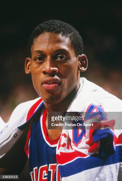 Detroit Pistons' forward Dennis Rodman sits on the bench during a game against the Washington Bullets at Capital Centre circa the 1990's in...