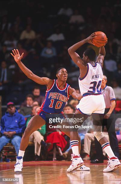 Detroit Pistons' forward Dennis Rodman guards against Washington Bullets' Bernard King at Capital Centre circa the 1990's in Washington, D.C.. NOTE...