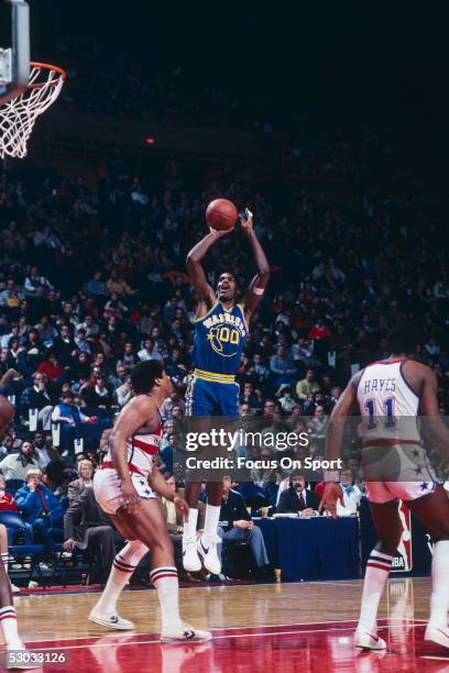 Golden State Warriors' Robert Parish makes a jumpshot over Washington Bullets' Wes Unsled at Capital Center circa 1979 in Washington, D.C.. NOTE TO...