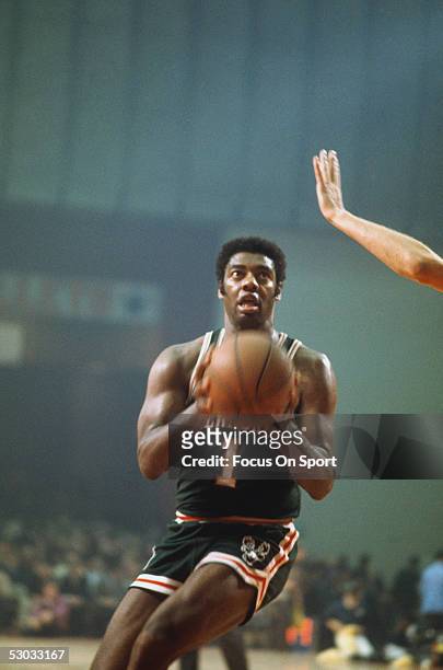 Milwaukee Bucks' guard Oscar Robertson eyes the basket and shoots during a game. NOTE TO USER: User expressly acknowledges and agrees that, by...