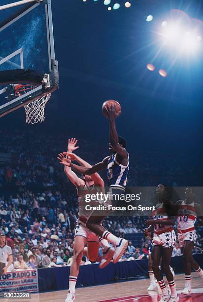 Denver Nuggets' David Thompson jumps for a layup during a game against the Washington Bullets at Capital Centre circa 1978 in Washington, D.C.. NOTE...