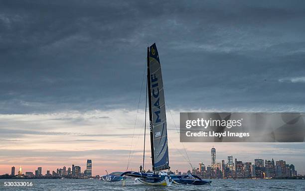 Francois Gabart on board his MACIF 105ft trimaran, celebrates after winning the 'Transat Bakerly' solo transatlantic yacht race May 10, 2016 on the...