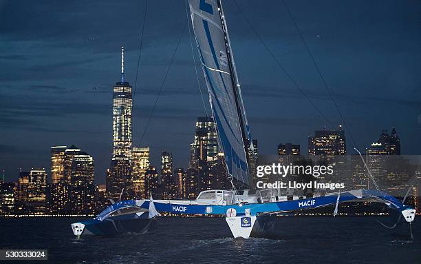 Francois Gabart on board his MACIF 105ft trimaran, celebrates after winning the 'Transat Bakerly' solo transatlantic yacht race May 10, 2016 on the...