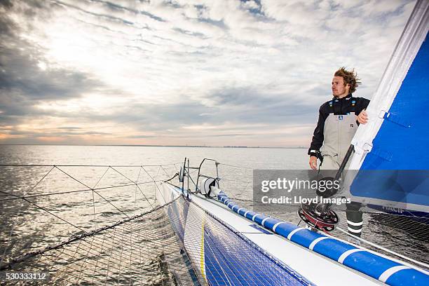 Francois Gabart on board his MACIF 105ft trimaran, celebrates after winning the 'Transat Bakerly' solo transatlantic yacht race May 10, 2016 on the...