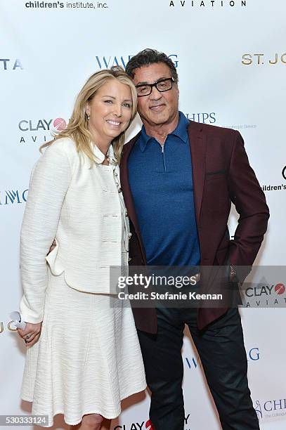 Tricia Elattrache and Sylvester Stallone attend CHIPS Luncheon Featuring St. John at Beverly Hills Hotel on May 10, 2016 in Beverly Hills, California.