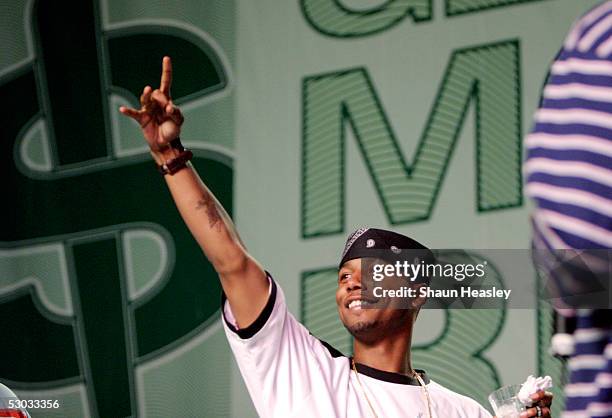 Juelz Santana gestures while making his way on stage to speak at the Hip-Hop Summit on Financial Empowerment held at the Washington Convention Center...